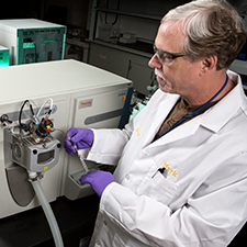 Chemist examines samples 